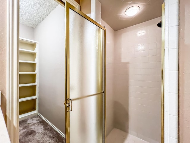 bathroom with a shower with shower door