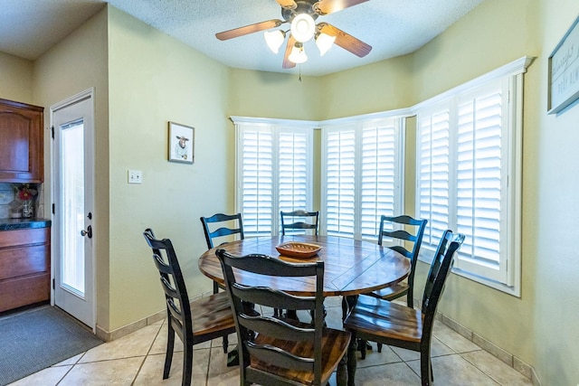 4306 Alcove Ave, Lubbock, TX 79407 - dining room with a wealth of natural light, light tile patterned floors, baseboards, and ceiling fan