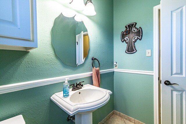 4306 Alcove Ave, Lubbock, TX 79407 - half bath with tile patterned floors and a sink