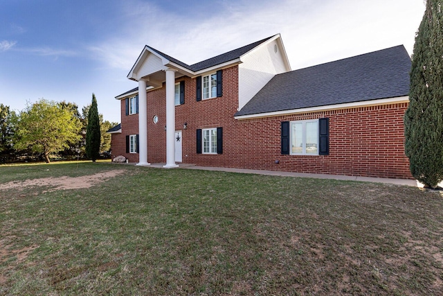 4306 Alcove Ave, Lubbock, TX 79407 - neoclassical home with a front lawn, a shingled roof, and brick siding