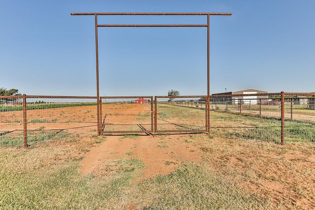 4306 Alcove Ave, Lubbock, TX 79407 - view of yard with a rural view, fence, and a gate