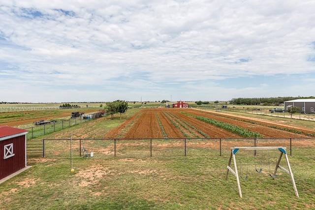 4306 Alcove Ave, Lubbock, TX 79407 - view of home's community featuring a lawn, a rural view, and fence