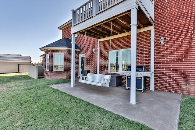 4306 Alcove Ave, Lubbock, TX 79407 - back of property featuring a yard, a patio, and brick siding