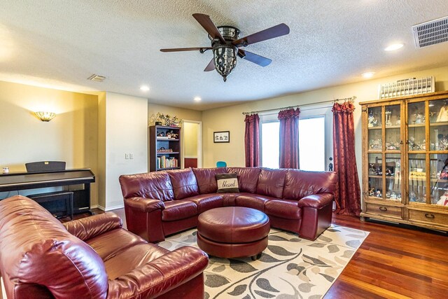 4306 Alcove Ave, Lubbock, TX 79407 - living room with a textured ceiling, visible vents, wood finished floors, and a ceiling fan