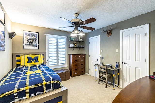 4306 Alcove Ave, Lubbock, TX 79407 - carpeted bedroom with a textured ceiling and a ceiling fan