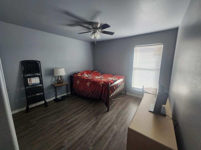 bedroom with dark wood-type flooring and ceiling fan