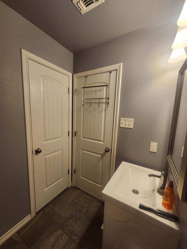 bathroom with a textured ceiling