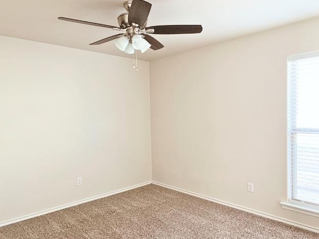 carpeted empty room with ceiling fan