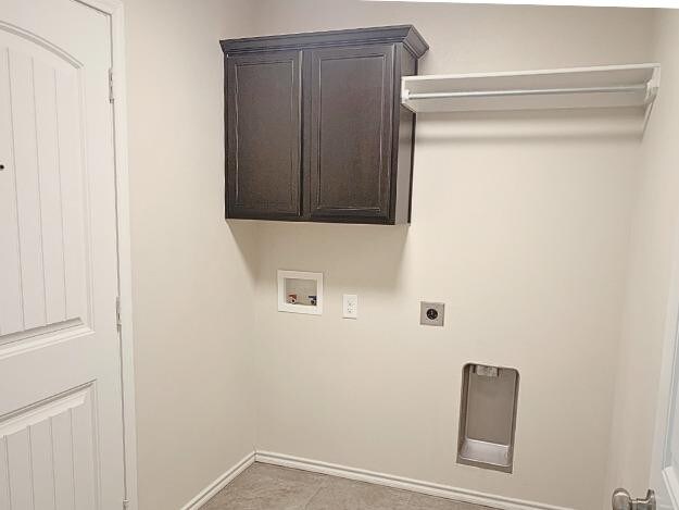 laundry area featuring hookup for a washing machine, electric dryer hookup, and cabinets