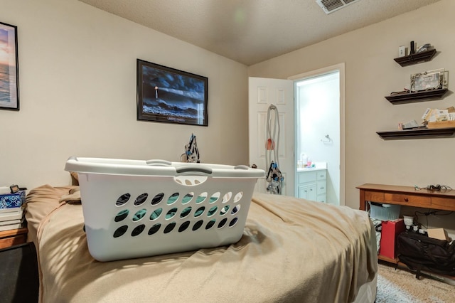 bedroom with connected bathroom