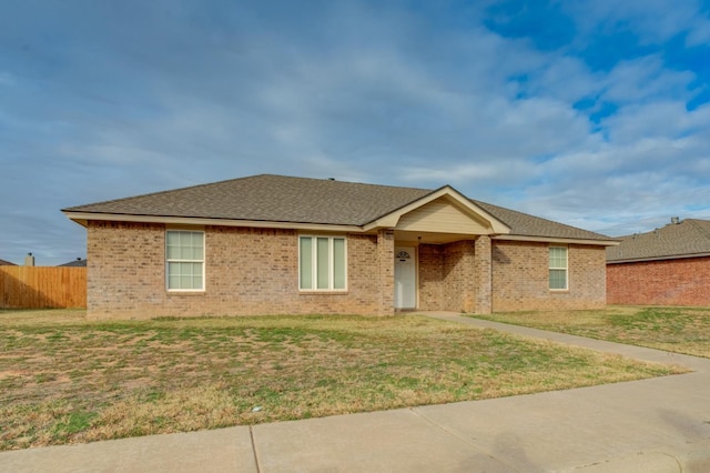 ranch-style house with a front lawn