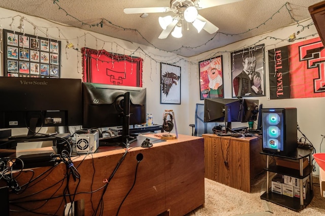 carpeted office featuring a textured ceiling and ceiling fan