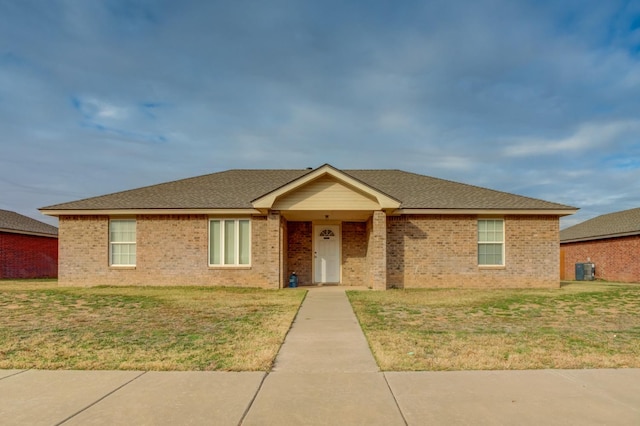 single story home with a front yard and cooling unit