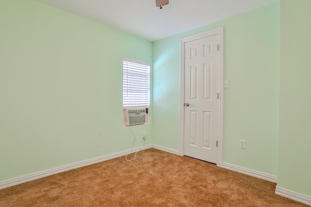 carpeted spare room featuring cooling unit