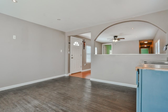 foyer featuring ceiling fan, dark hardwood / wood-style floors, and sink