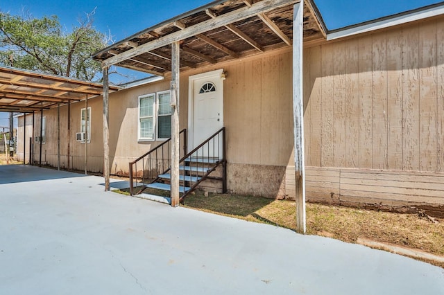 entrance to property with a carport