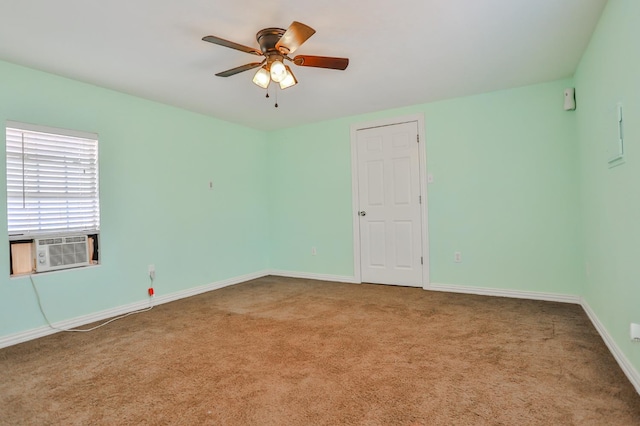 carpeted spare room with cooling unit and ceiling fan