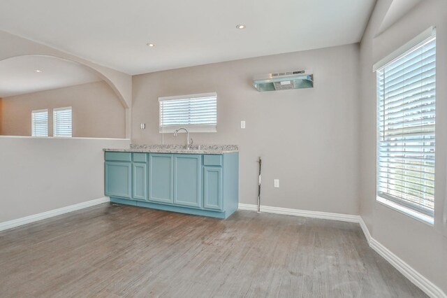 kitchen featuring sink, plenty of natural light, and light hardwood / wood-style floors