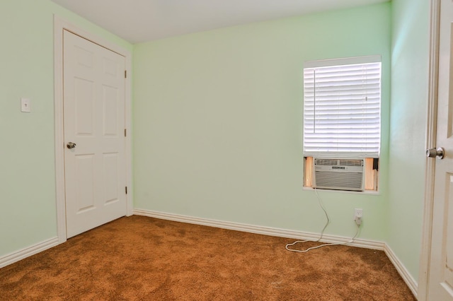 unfurnished room featuring carpet and cooling unit