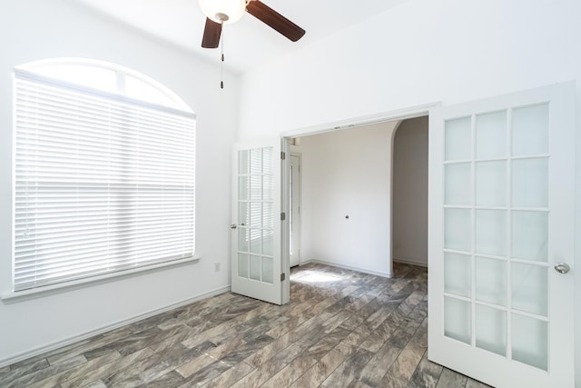 9610 Kline Ave, Lubbock, TX 79424 - spare room with wood finished floors, arched walkways, french doors, and a ceiling fan