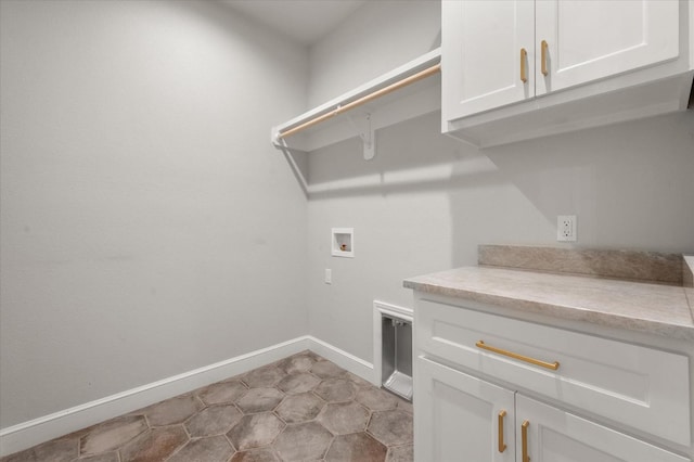 laundry room with cabinets and washer hookup