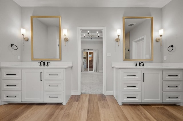 bathroom with vanity and hardwood / wood-style flooring