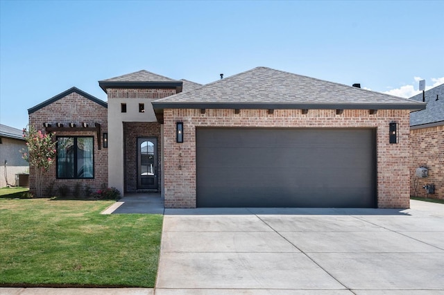 view of front facade featuring a garage and a front yard