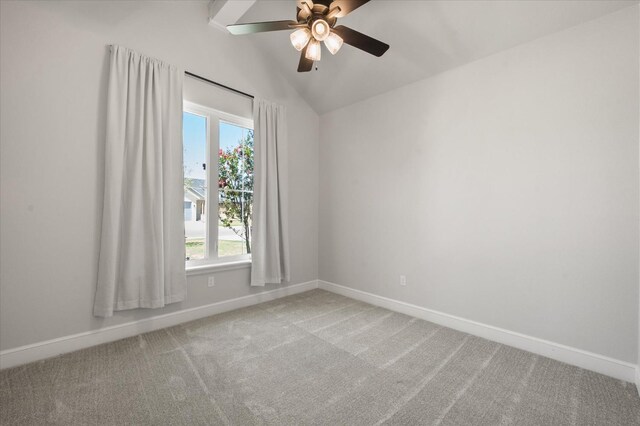 carpeted empty room featuring lofted ceiling and ceiling fan