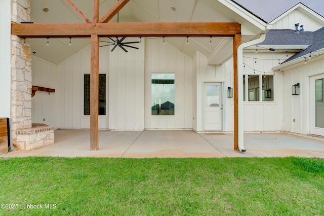 3513 County Road 7650, Lubbock, TX 79423 - rear view of house featuring board and batten siding, a patio area, and a lawn