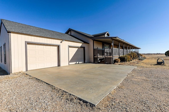 view of front of property with a garage and covered porch