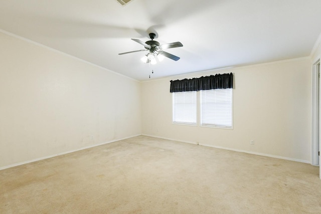 unfurnished room with ornamental molding, light carpet, and ceiling fan