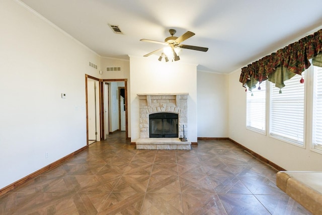 unfurnished living room featuring crown molding, parquet floors, ceiling fan, and a fireplace