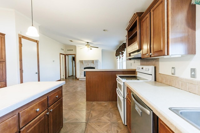 kitchen with a fireplace, decorative light fixtures, range with two ovens, stainless steel dishwasher, and ceiling fan