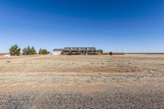 view of yard with a rural view