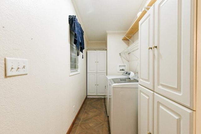 washroom featuring cabinets, ornamental molding, washer and clothes dryer, and dark parquet floors