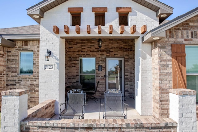 property entrance with a patio area