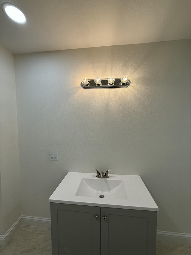 bathroom featuring vanity and baseboards