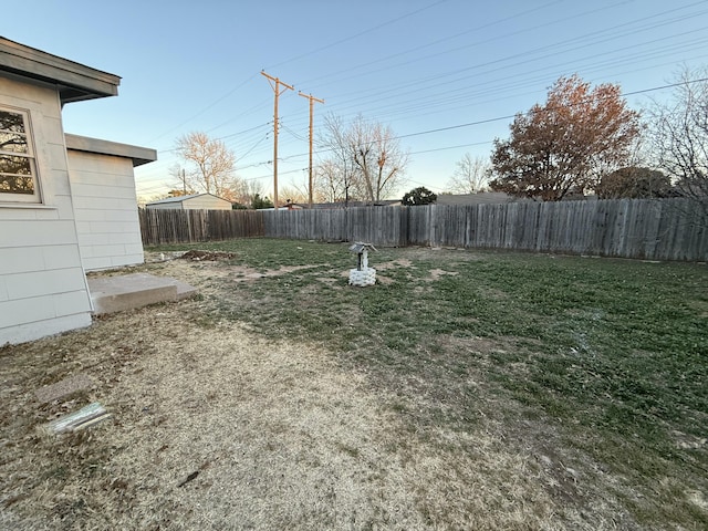 view of yard with a fenced backyard