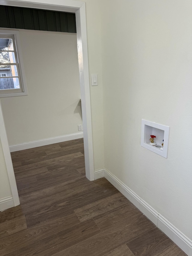 laundry area featuring dark wood-style floors, washer hookup, laundry area, and baseboards