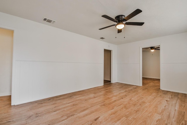 spare room with light hardwood / wood-style flooring and ceiling fan