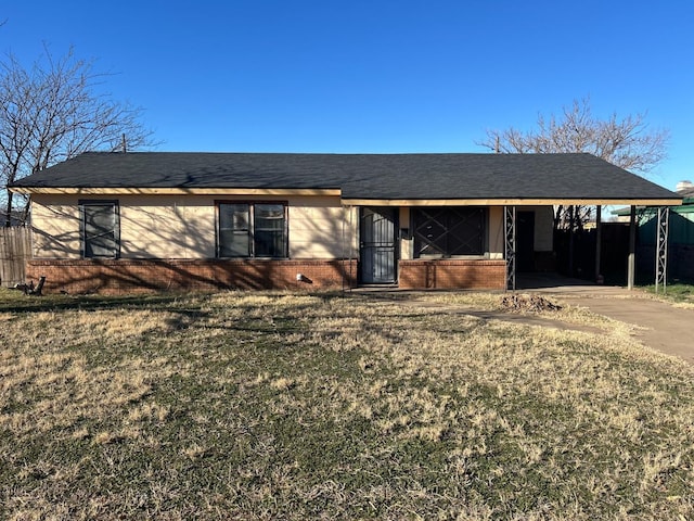 ranch-style house with a carport and a front yard