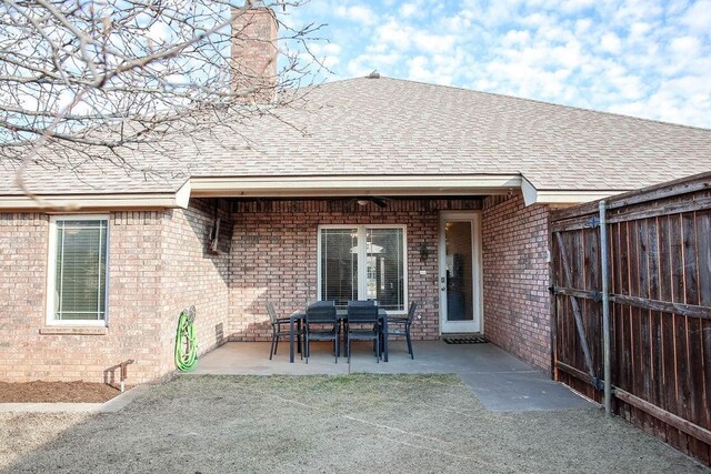 back of house with a patio