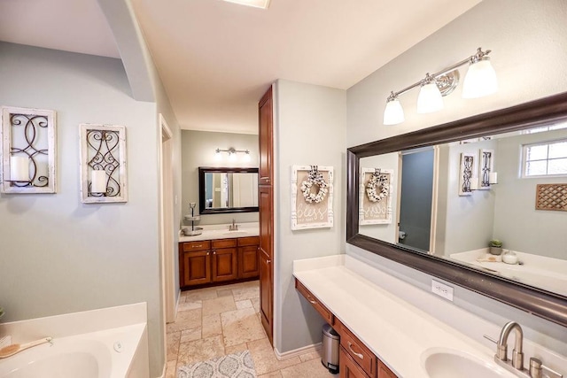 bathroom with vanity and a washtub