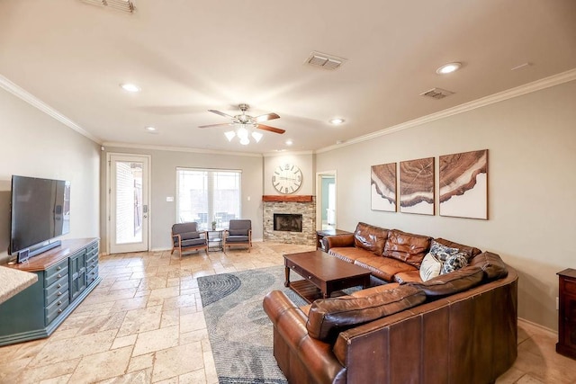 living room featuring crown molding, a stone fireplace, and ceiling fan