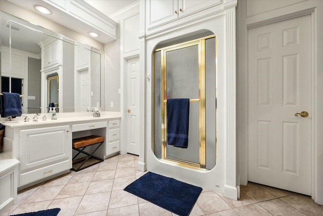 9214 York Pl, Lubbock, TX 79424 - bathroom with double vanity, tile patterned floors, crown molding, and a stall shower