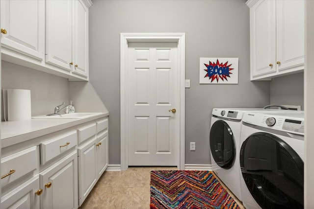 9214 York Pl, Lubbock, TX 79424 - laundry room with cabinet space, separate washer and dryer, baseboards, and a sink