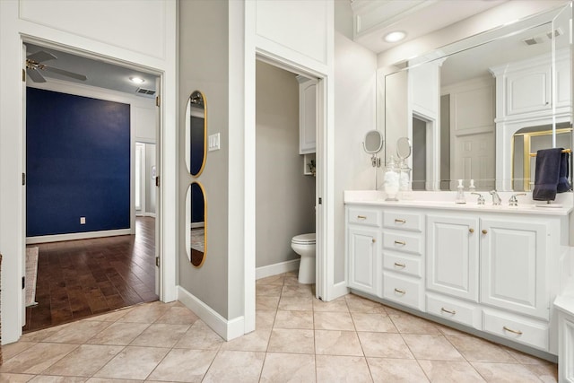 9214 York Pl, Lubbock, TX 79424 - bathroom with vanity, baseboards, and toilet