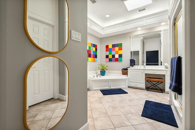 9214 York Pl, Lubbock, TX 79424 - full bath featuring tile patterned floors, recessed lighting, baseboards, visible vents, and a bath