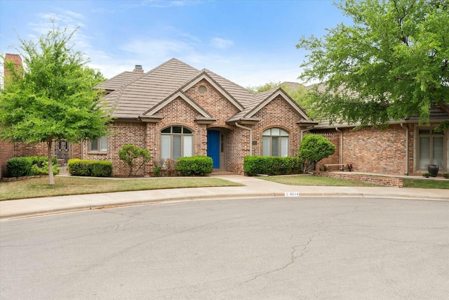 9214 York Pl, Lubbock, TX 79424 - view of front of house with a chimney and brick siding