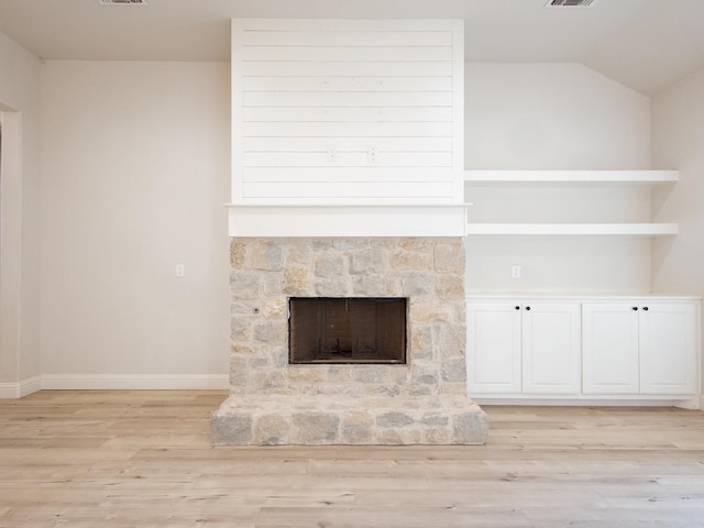 room details with hardwood / wood-style flooring and a fireplace